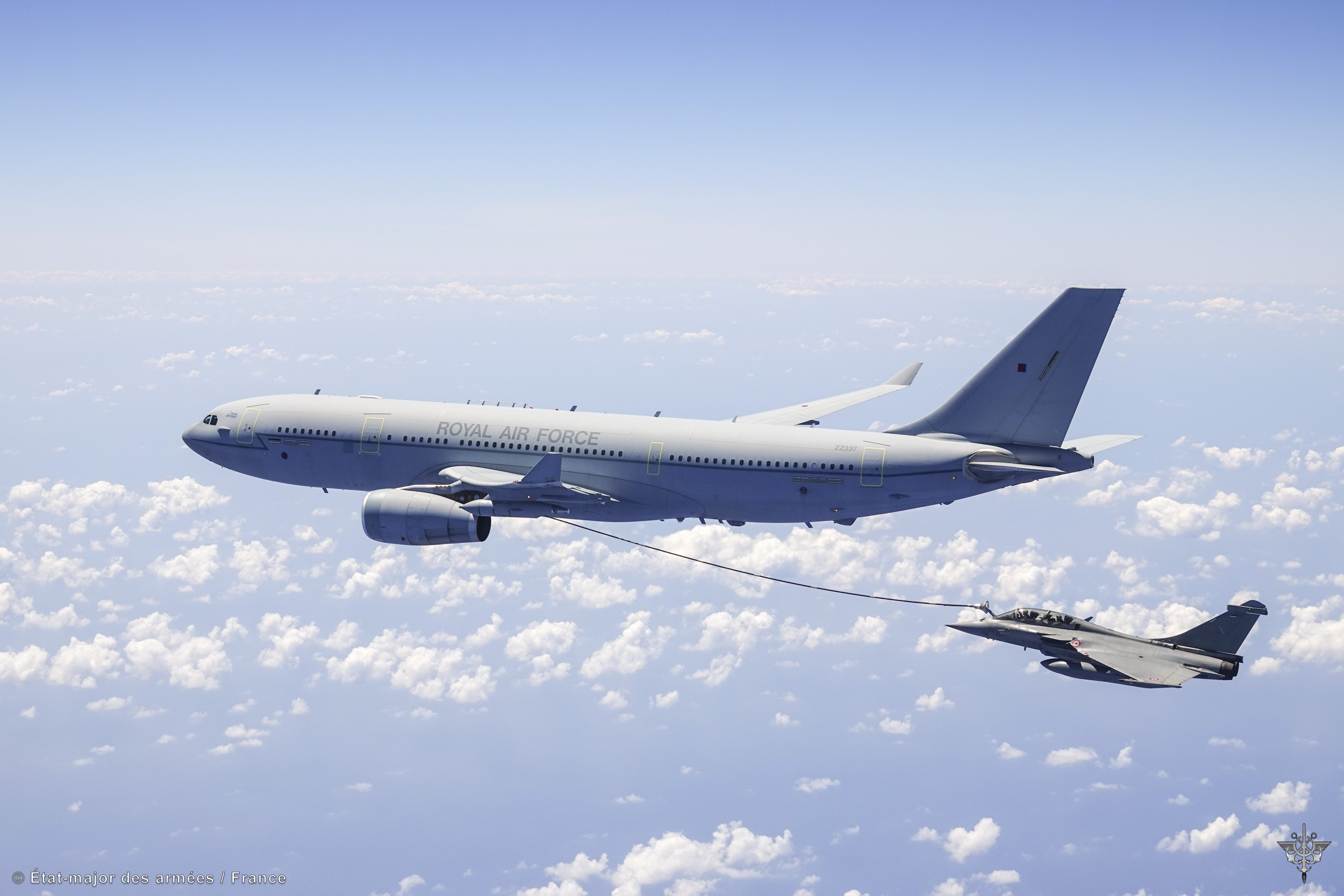 Image shows RAF Typhoon refuelling RAF Voyager in the air.